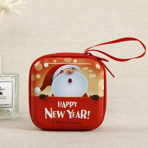 Close-up of red Christmas Santa coin purse with zipper closure and hanging strap