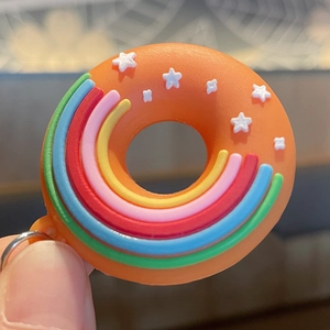 Porte-clés donut orange créatif avec rayures arc-en-ciel et étoiles sur pendentif silicone