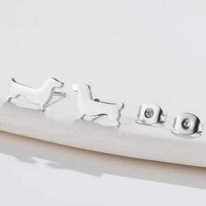 Minimalist silver stainless steel corgi dog stud earrings with a polished finish