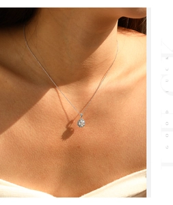 Detailed view of an S925 silver hexagonal pendant necklace with a central round gemstone