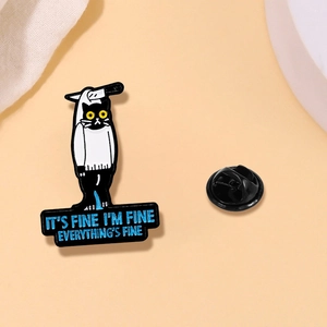 Macro detail of black enamel cat pin with sarcastic fine text and rubber backer