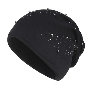 Women's black knit beanie hat with silver metallic studs and warm winter lining