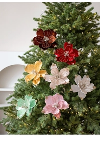 Detail of velvet magnolia flowers with gold glitter edges and beads for Christmas tree decor