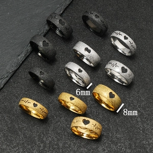 Detailed comparison of 6mm and 8mm matte heartbeat rings in gold, silver, and black