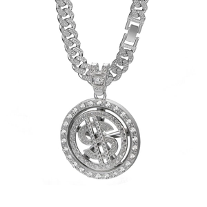 Macro shot of rotating silver dollar sign pendant with sparkling pavé stones on Cuban chain