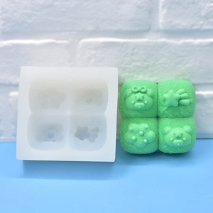 Green 4-cavity silicone mold for bear, star, and flower shaped soap or fondant cakes