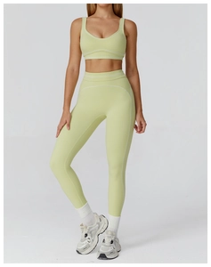 Detail of high-stretch lime green yoga set with white contrast trim and V-neck bra