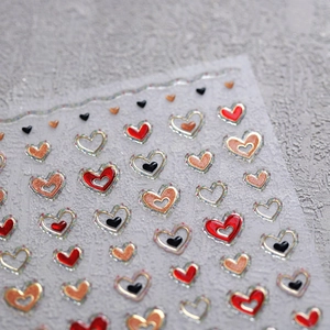 3D heart nail stickers with gold metallic edges and glitter red gold black patterns