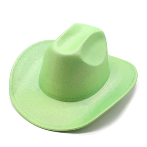 Detail of light green glitter cowboy hat with glossy texture and curved brim for parties