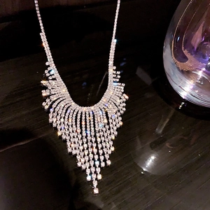 Macro view of silver fringe tassel necklace with shimmering crystal rhinestones for women