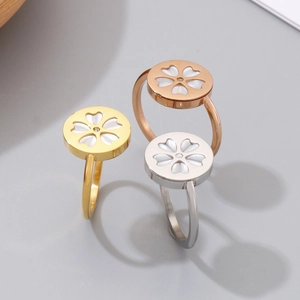 Set of minimalist stainless steel cherry blossom rings in gold, rose gold and silver finish