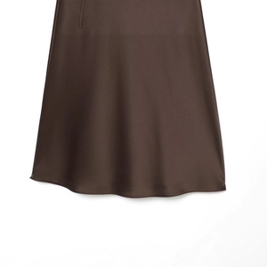 Elegant deep brown satin maxi skirt with silky texture and draped hem on white background