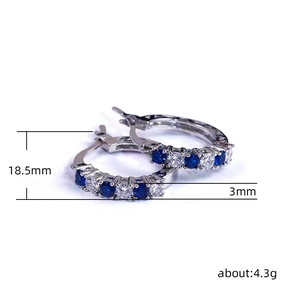 Silver earrings with alternating blue and white cubic zirconia stones, 18.5mm outer diameter