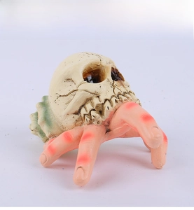 Macro detail of Halloween resin sculpture featuring a skull combined with skeletal fingers