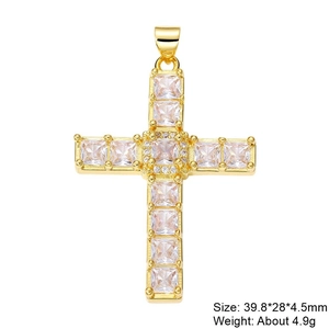 Detail of gold cross pendant with cubic zirconia inlay and product dimensions