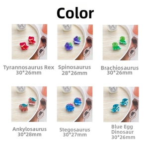 Detail view of mini cartoon dinosaur hair clips in various colors and sizes