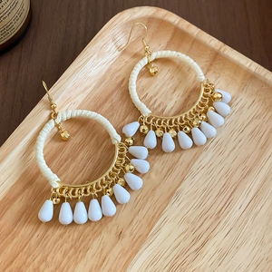 Bohemian style earrings with cream cotton rope weaving and white teardrop shaped pendants