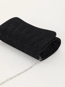 Detailed view of pleated glitter evening clutch bag in black with silver chain