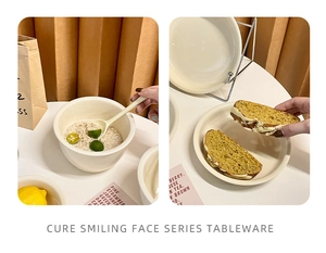 Macro shot of creamy ceramic bowls and plates featuring minimalist lifestyle dining aesthetic