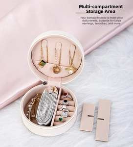 Detail of round PU leather jewelry box with necklace hooks and ring storage slots
