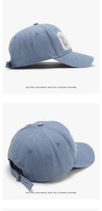 Detail of washed denim baseball cap with frayed patch and adjustable metal buckle
