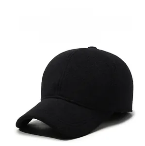 Detail of wool baseball cap with ear flaps and side metal shield logo decoration