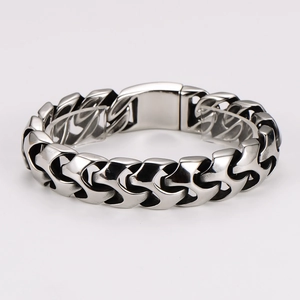 Industrial style silver stainless steel chunky chain bracelet on white background