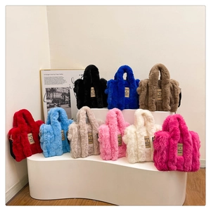 Variety of colorful faux fur tote bags with Have a Nice Day tag on tiered display