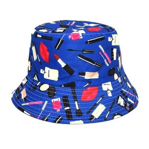 Close-up of the cosmetic makeup print patterns on the navy blue cotton bucket hat
