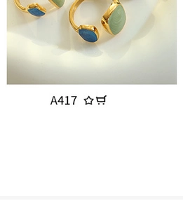 Detail of gold open ring with irregular blue and light green polished gemstones