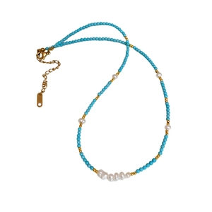 Beaded necklace with turquoise, freshwater pearls and golden steel chain for women