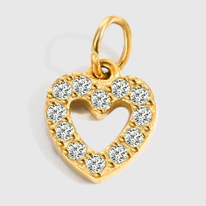 Detailed close-up of a heart-shaped gold pendant with sparkling pavé zircons and metal ring