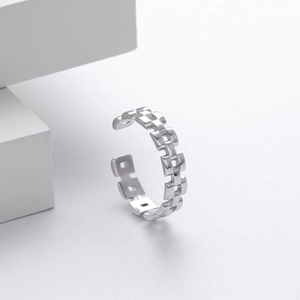 Macro detail of S925 sterling silver chain ring with hollow geometric link design