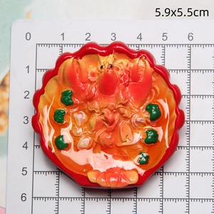 Detailed top view of 5.9x5.5cm resin lobster food magnet with broccoli detail