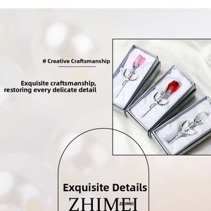 Detailed close-up of crystal rose flower gift set with metallic silver stem and luxury box
