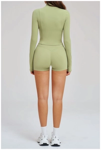 Back view detail of light green slim fit sports set with high waist shorts and jacket