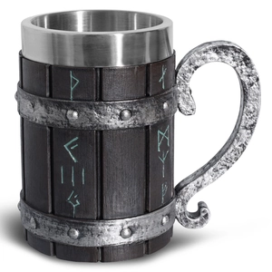 Detailed close-up of Viking wooden beer mug with rune carvings and textured handle