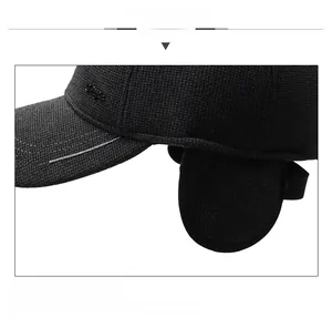 Detailed view of winter baseball cap with ear flaps and thick knit texture