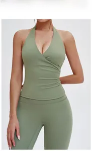Detail of light army green V-neck halter yoga top with flattering side ruching texture