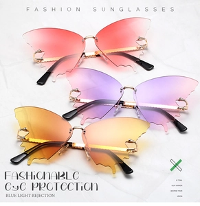 Detailed view of butterfly-shaped rimless sunglasses with gradient lenses and metal temples