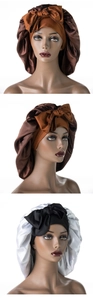 Detail of satin bonnet with wide bow tie strap showing silk texture and glossy finish