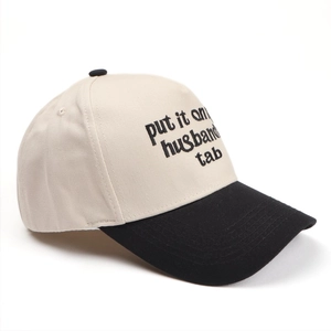 Detail view of cotton baseball cap featuring high-quality contrast letter embroidery