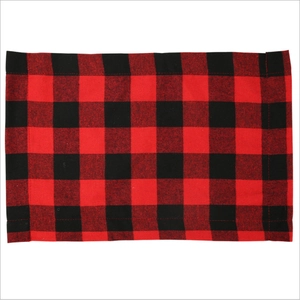 Detail of red and black buffalo plaid placemat with reinforced stitched edges on white background