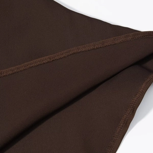 Detailed close-up showing precision stitching and premium satin fabric texture in dark brown