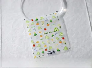 Close-up of TS-3062 thin nail stickers with cute green dinosaurs and fruit patterns