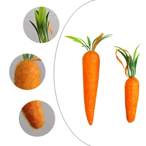 Artificial orange Easter carrots with green leaves for festive home decoration