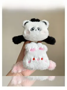 Detail of plush panda and white rabbit hair clips with soft faux fur and embroidery