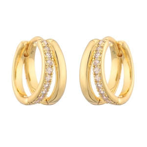 Detailed macro of gold triple-layer hoop earrings with sparkling pave zircon accents