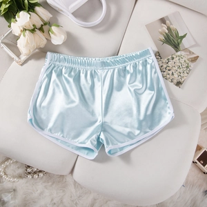 Detailed view of light blue satin sports shorts with white trim and elastic waistband