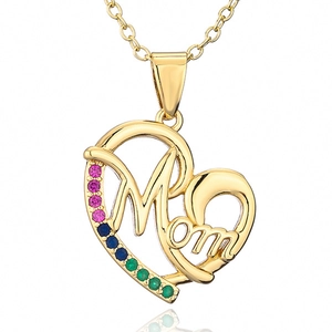 Detail of gold heart pendant necklace featuring Mom engraving and colorful gemstones